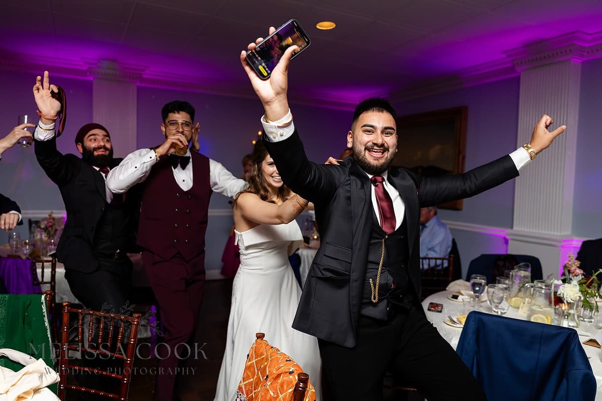 Groomsman celebrating on the dance floor