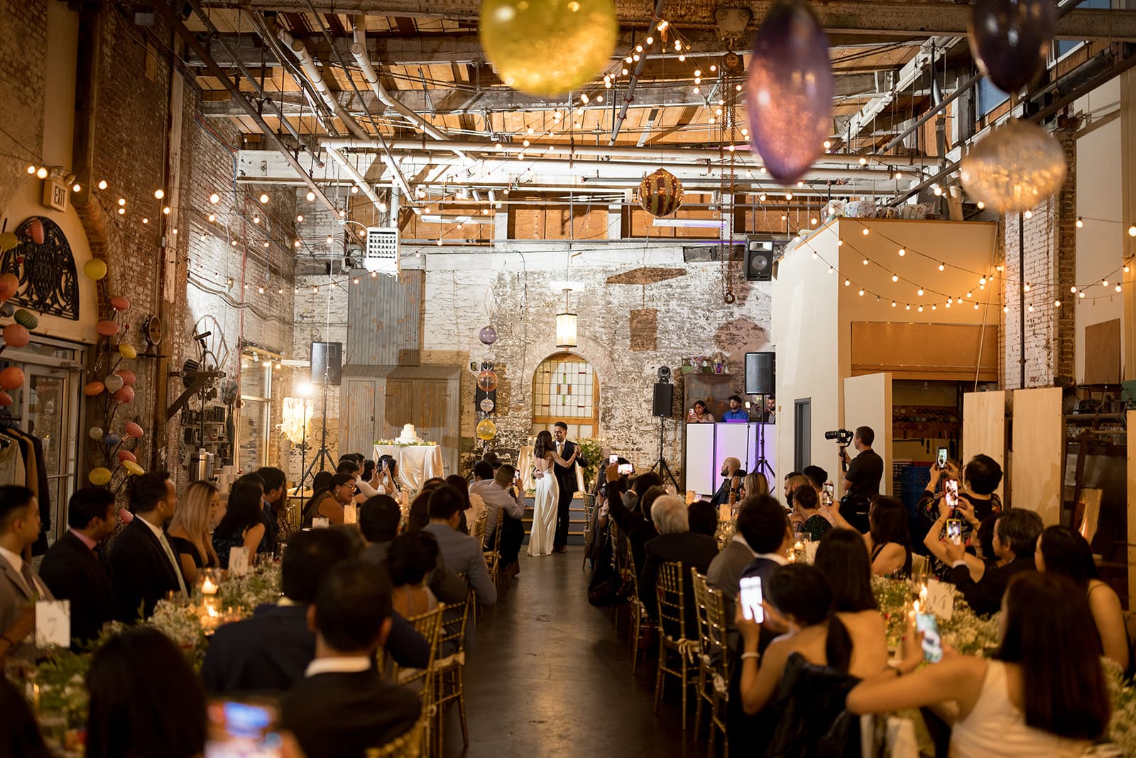 Guests celebrating at wedding reception venue
