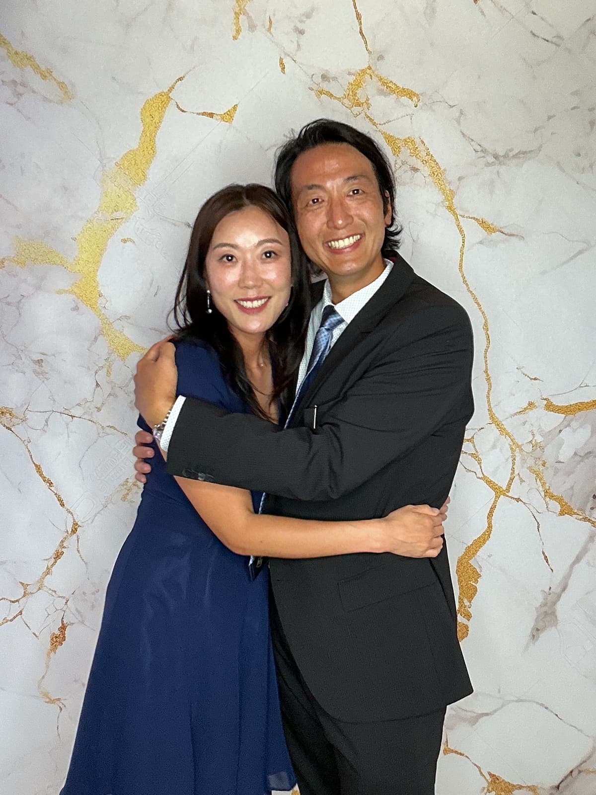Guests posing in the photo booth at wedding reception